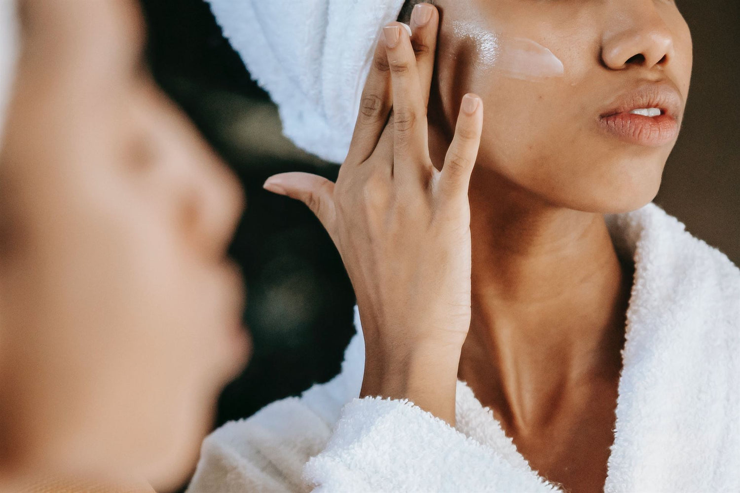 house of tallow healing and soothing tallow face cream woman applying cream to the face