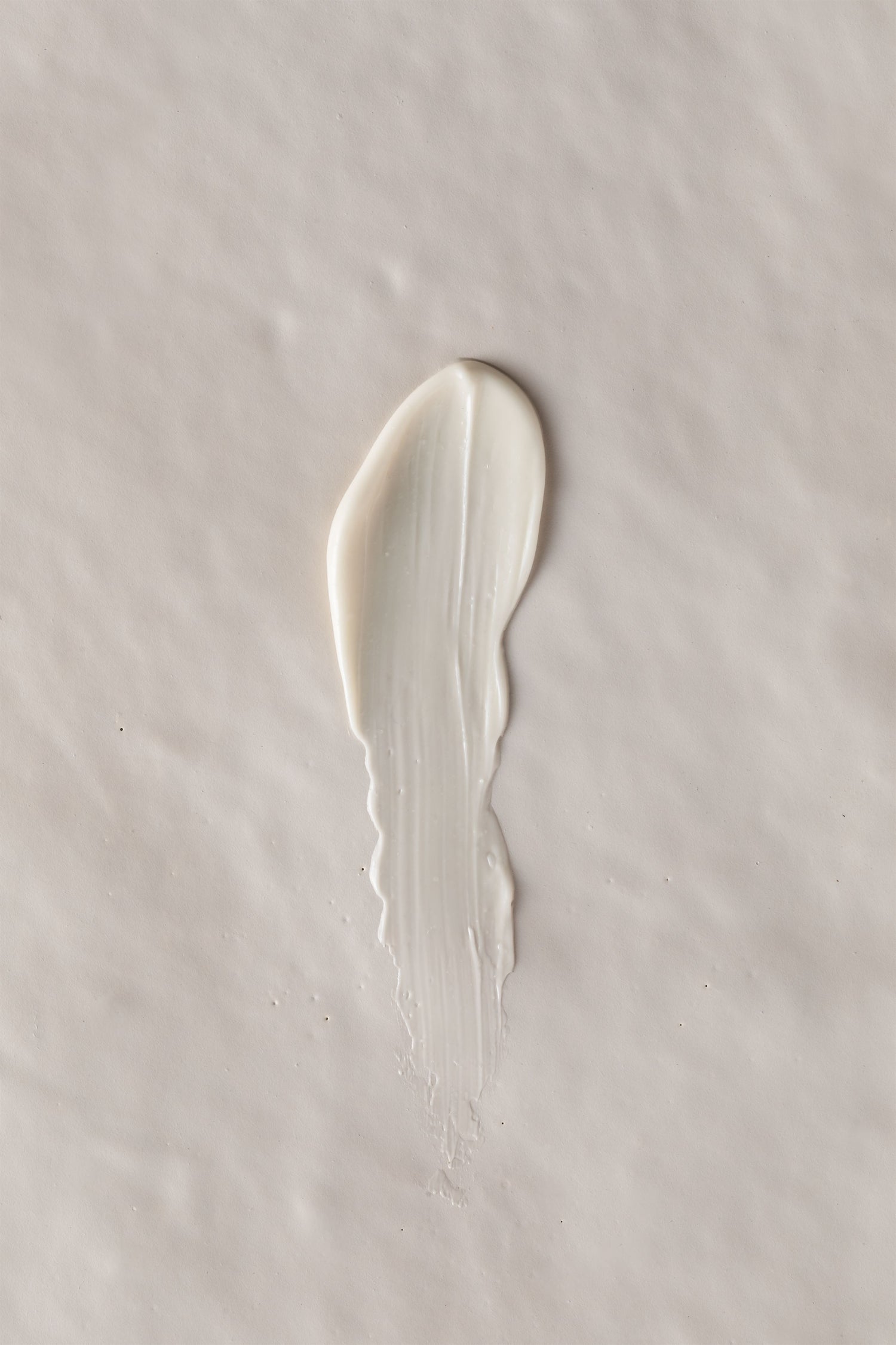 house of tallow body cream texture on neutral background